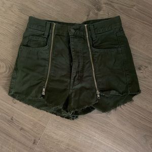 Green high waisted jean shorts with zipper accent